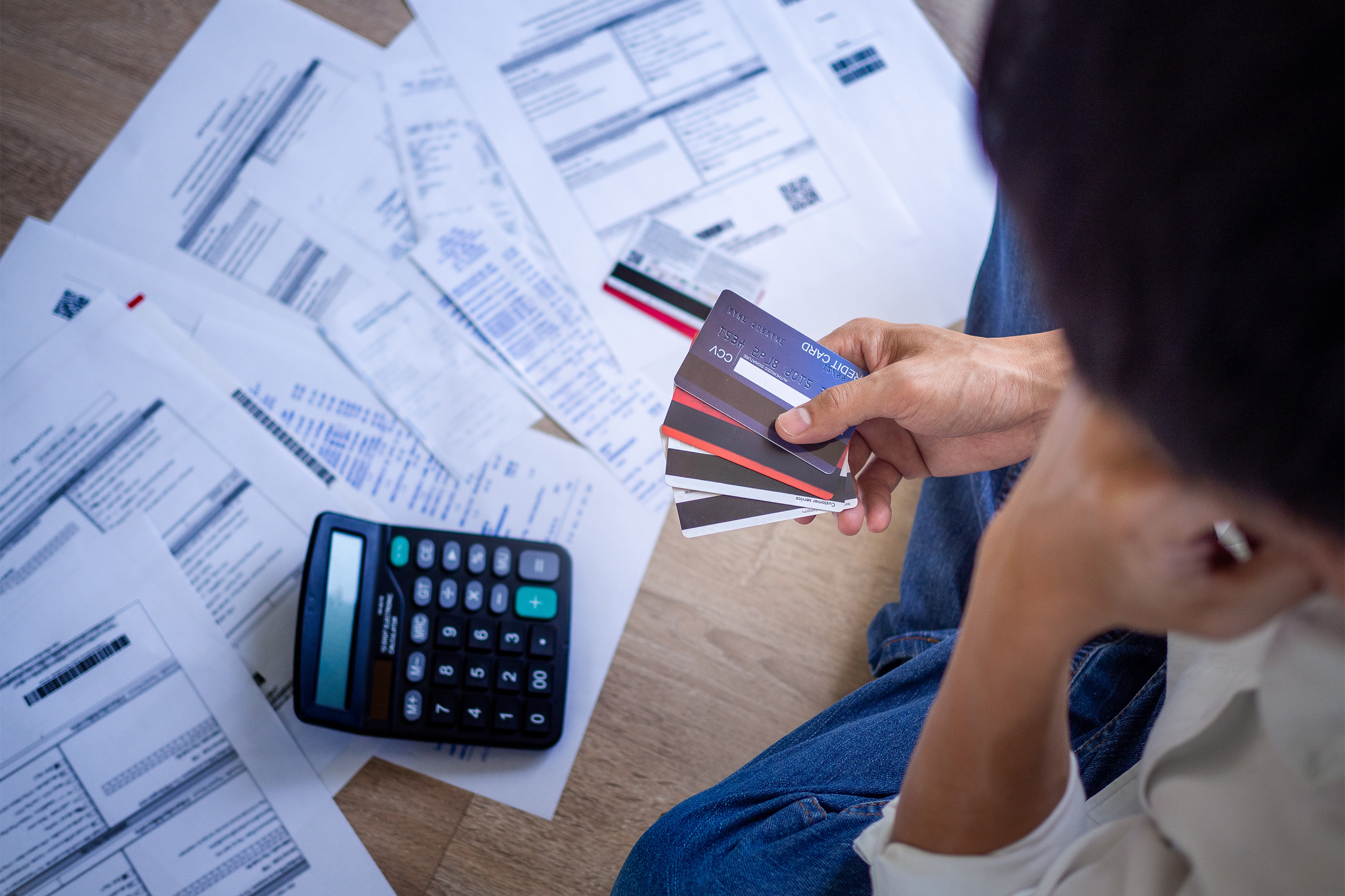 Person figuring out her credit cards