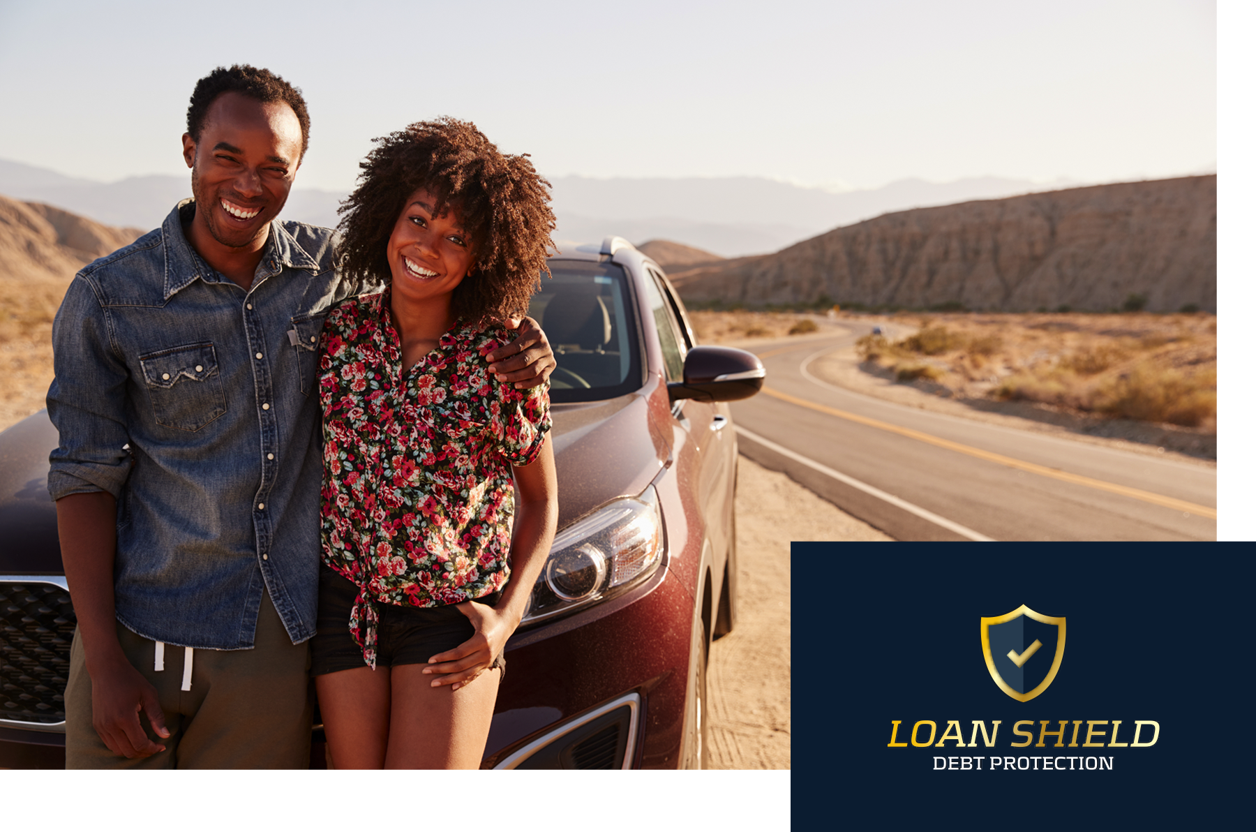 Couple standing by card and Loan Shield logo