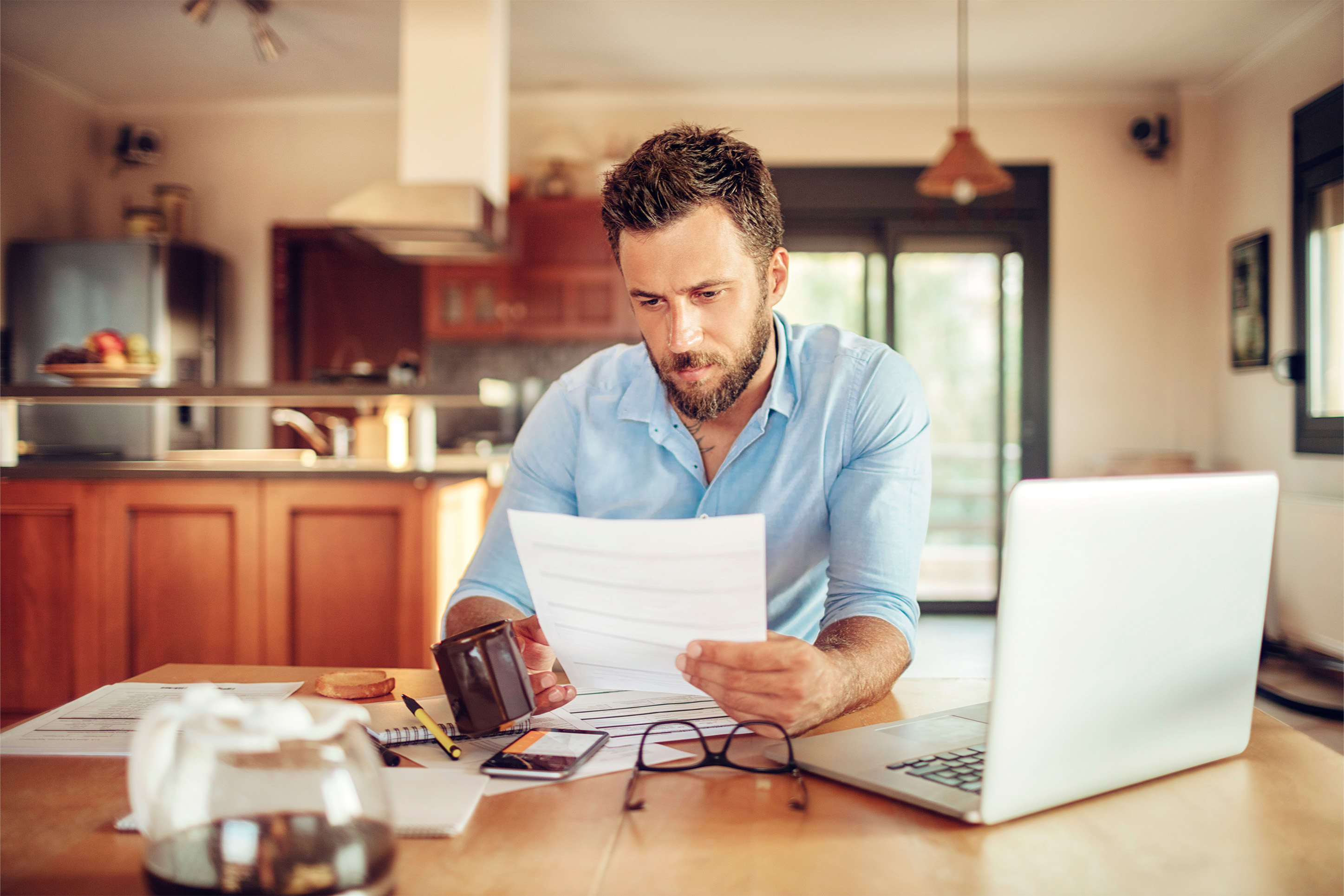 Man reviewing financial statements