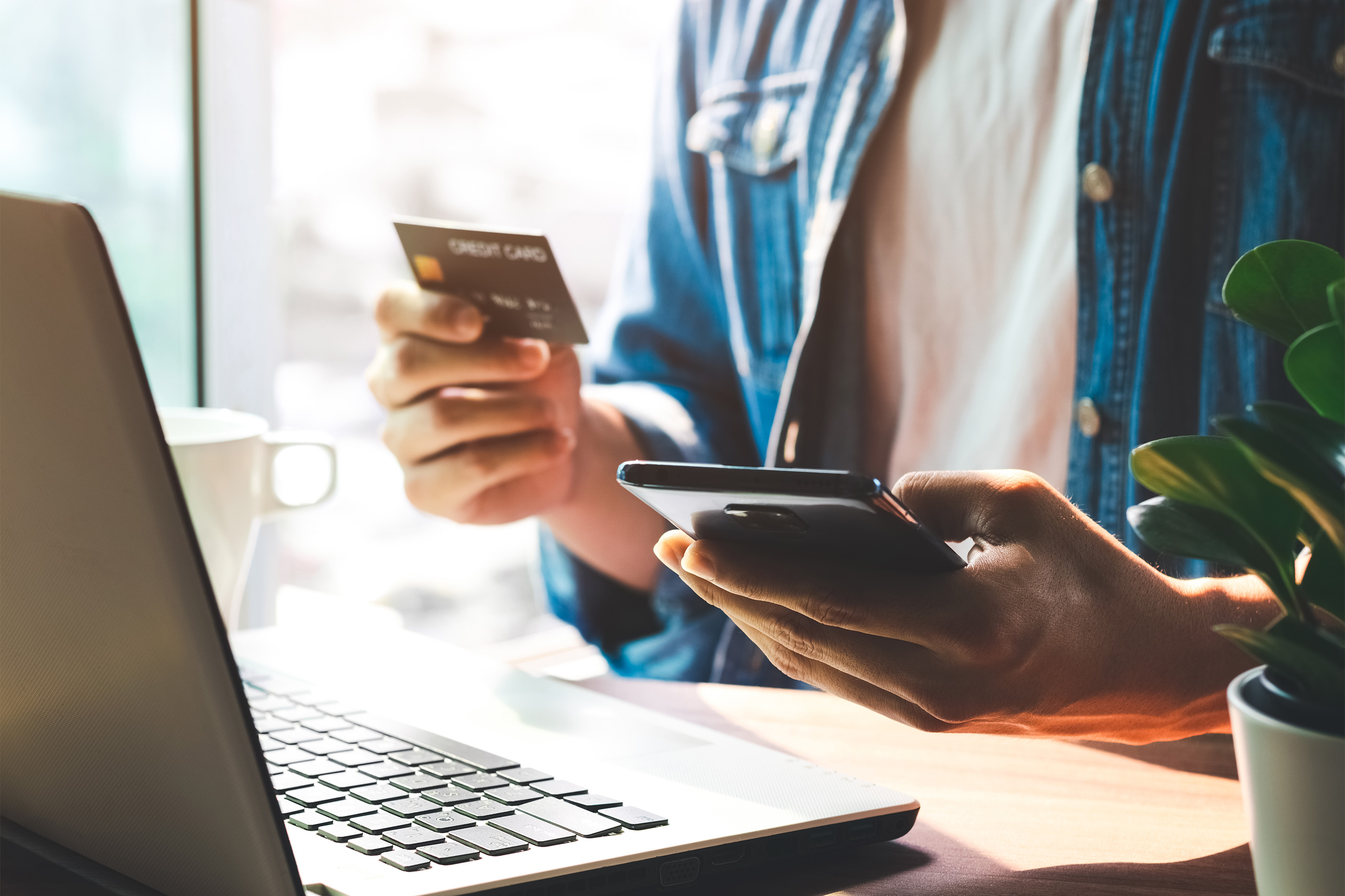 man shopping online with a credit card