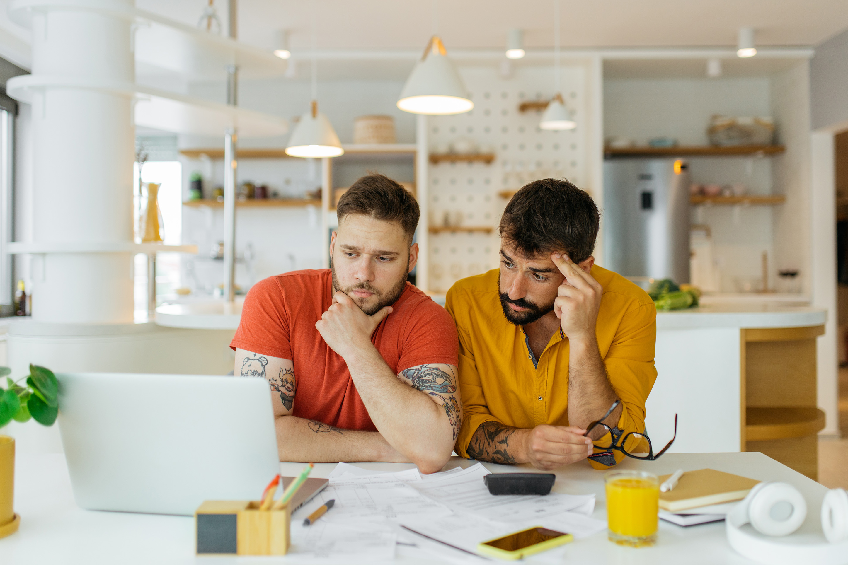 Two men discussing their finances. 