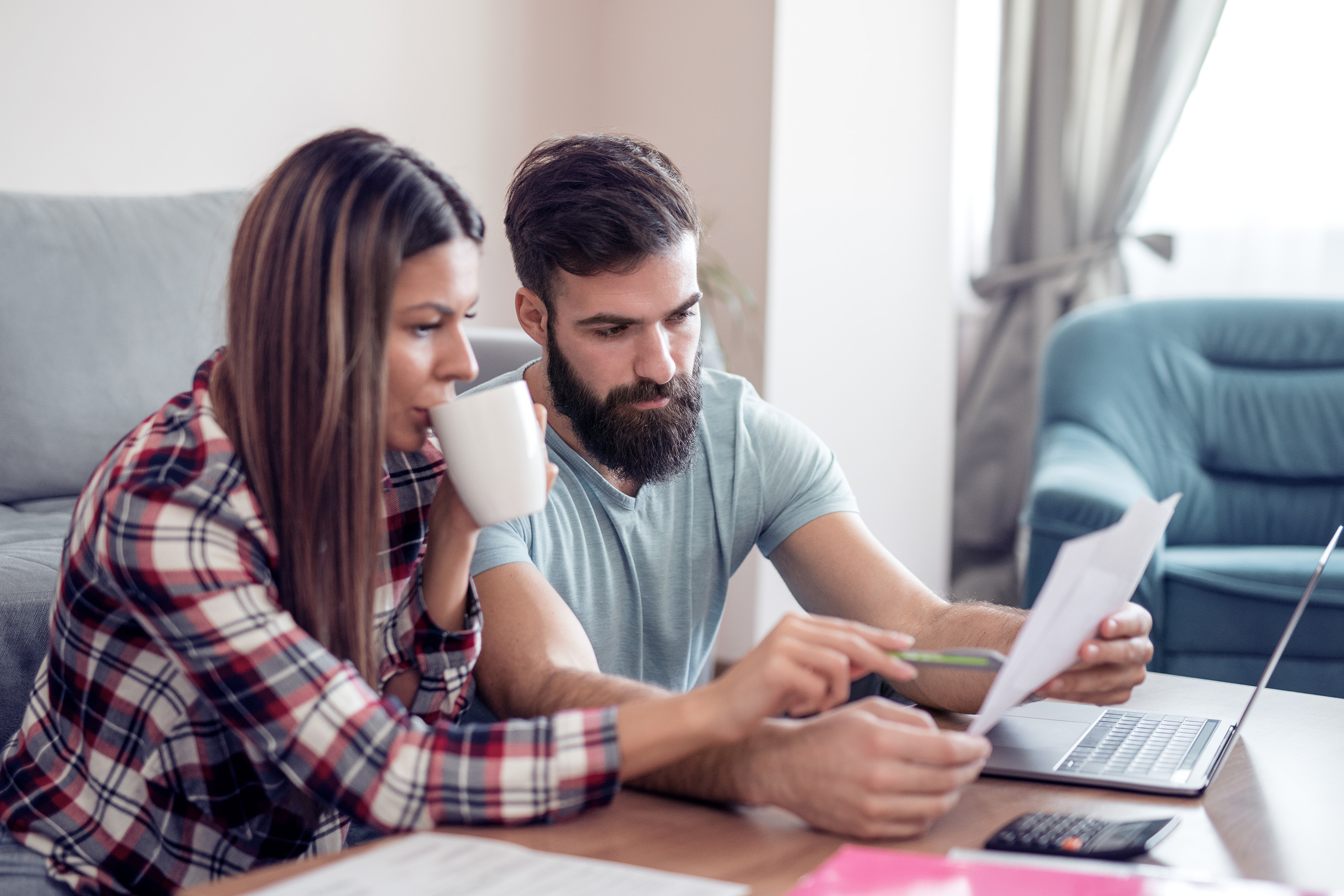 Couple figuring out their finances. 