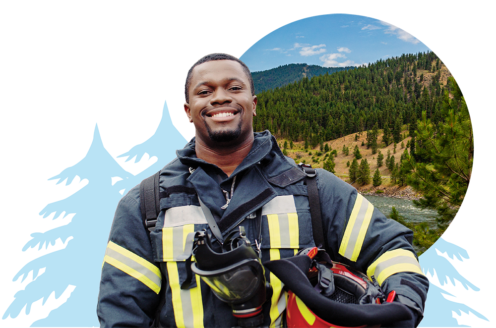 A first responder in an EMT uniform with trees and a Montana landscape in the background.