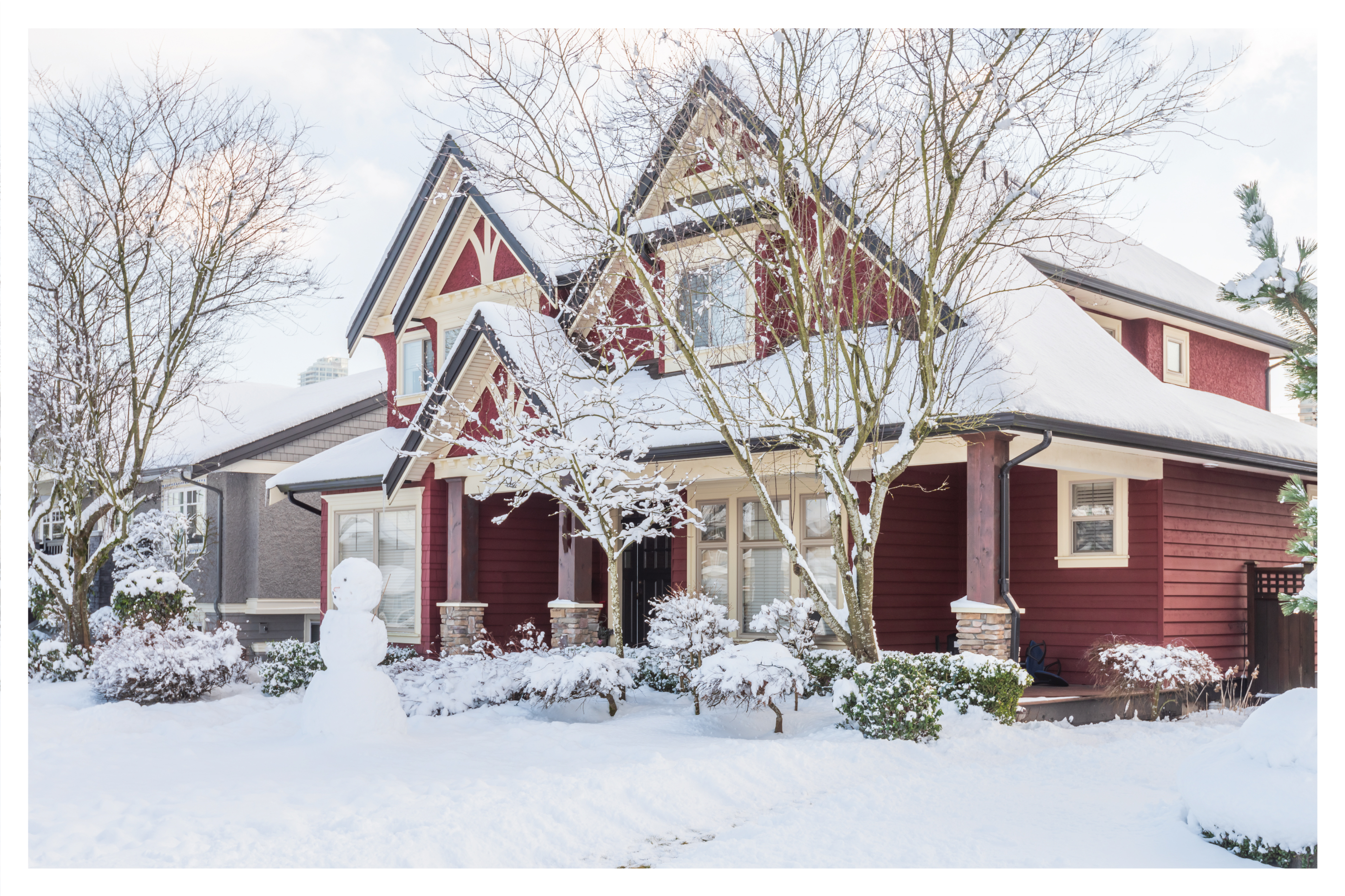 a home covered in snow in the winter