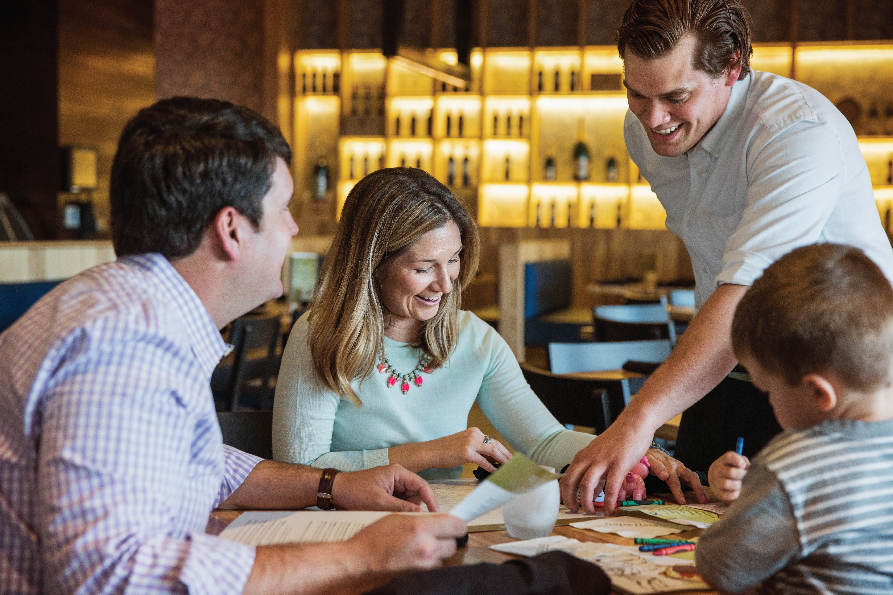 family enjoying a night out at a restaurant