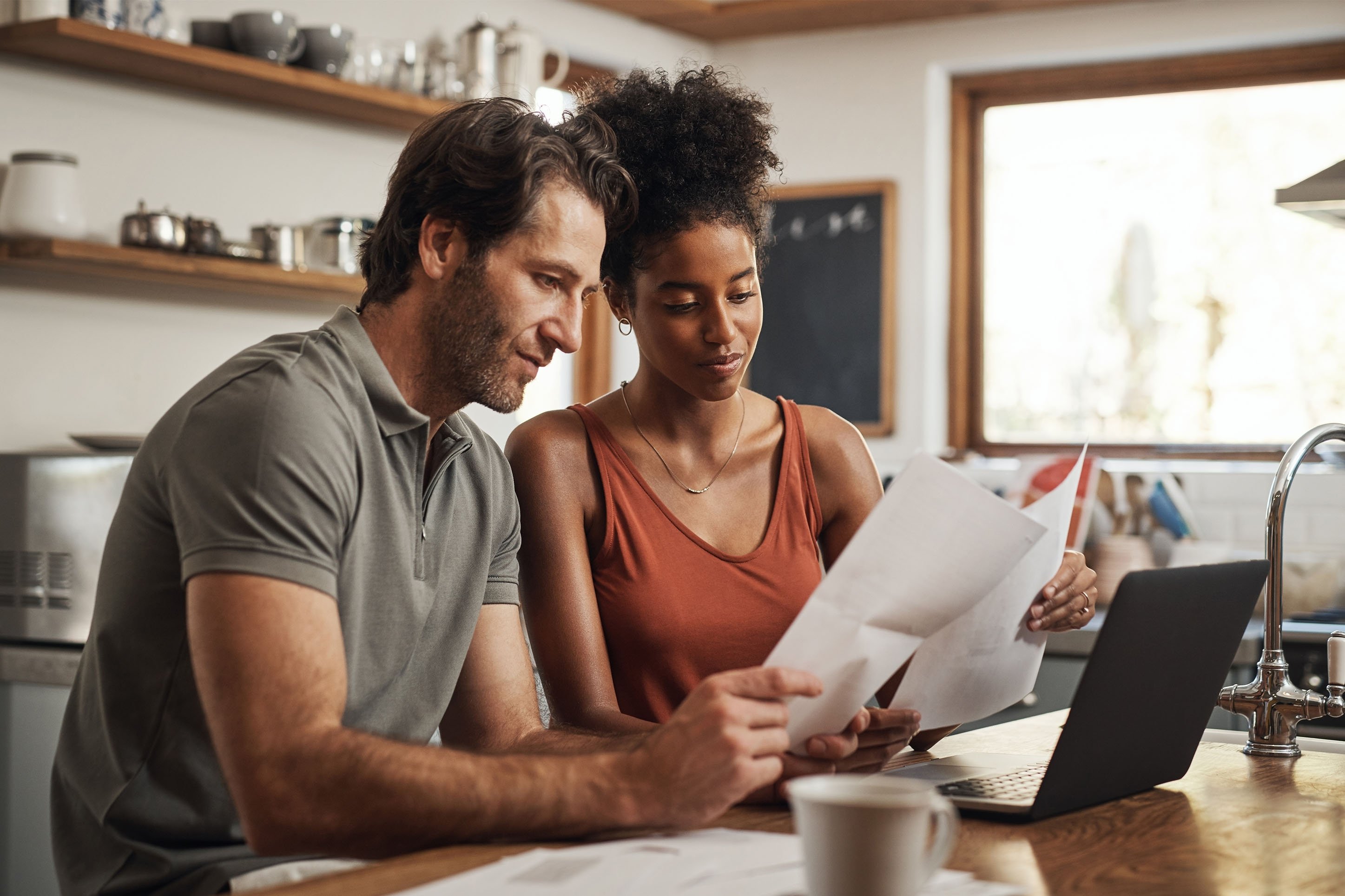 A couple studing their finances. 