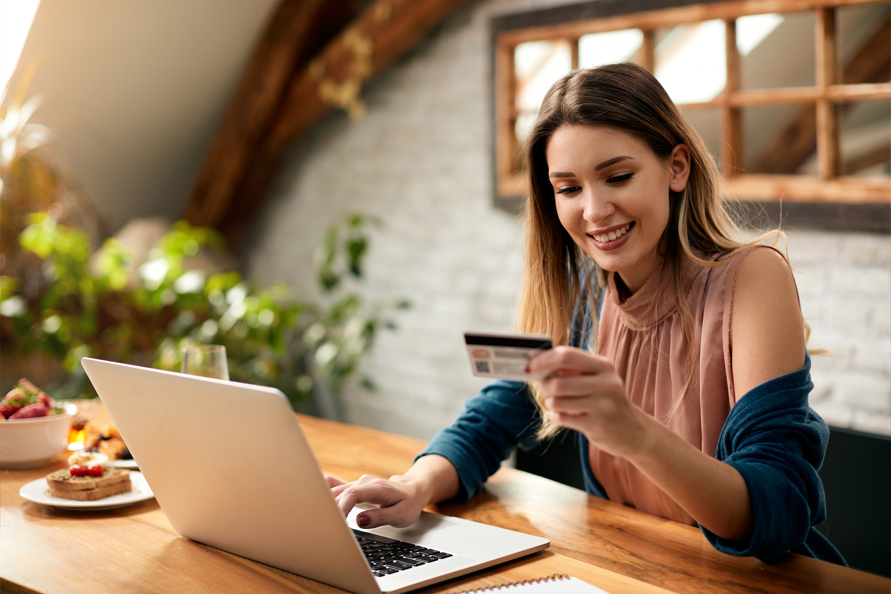 Young woman doing finances on her computer. 