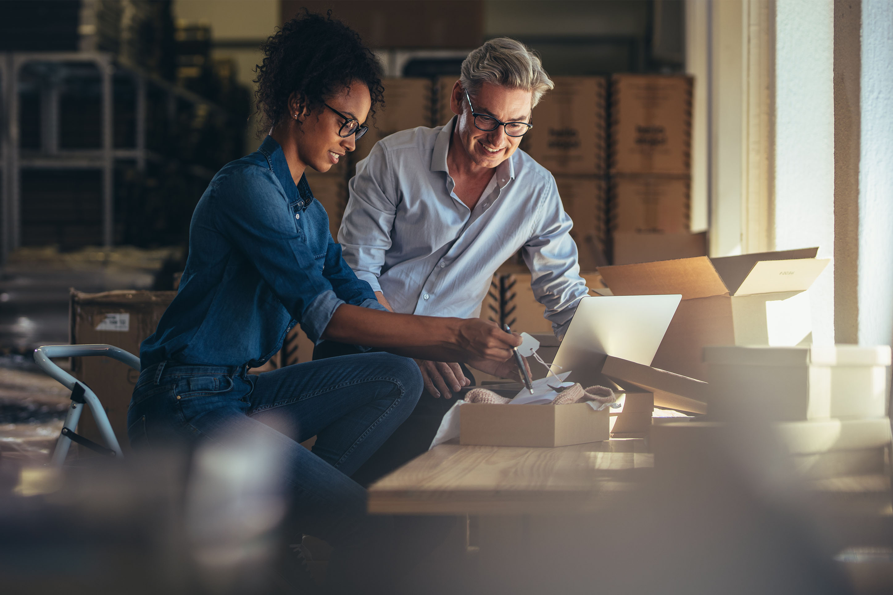 man and woman looking at a computer. 