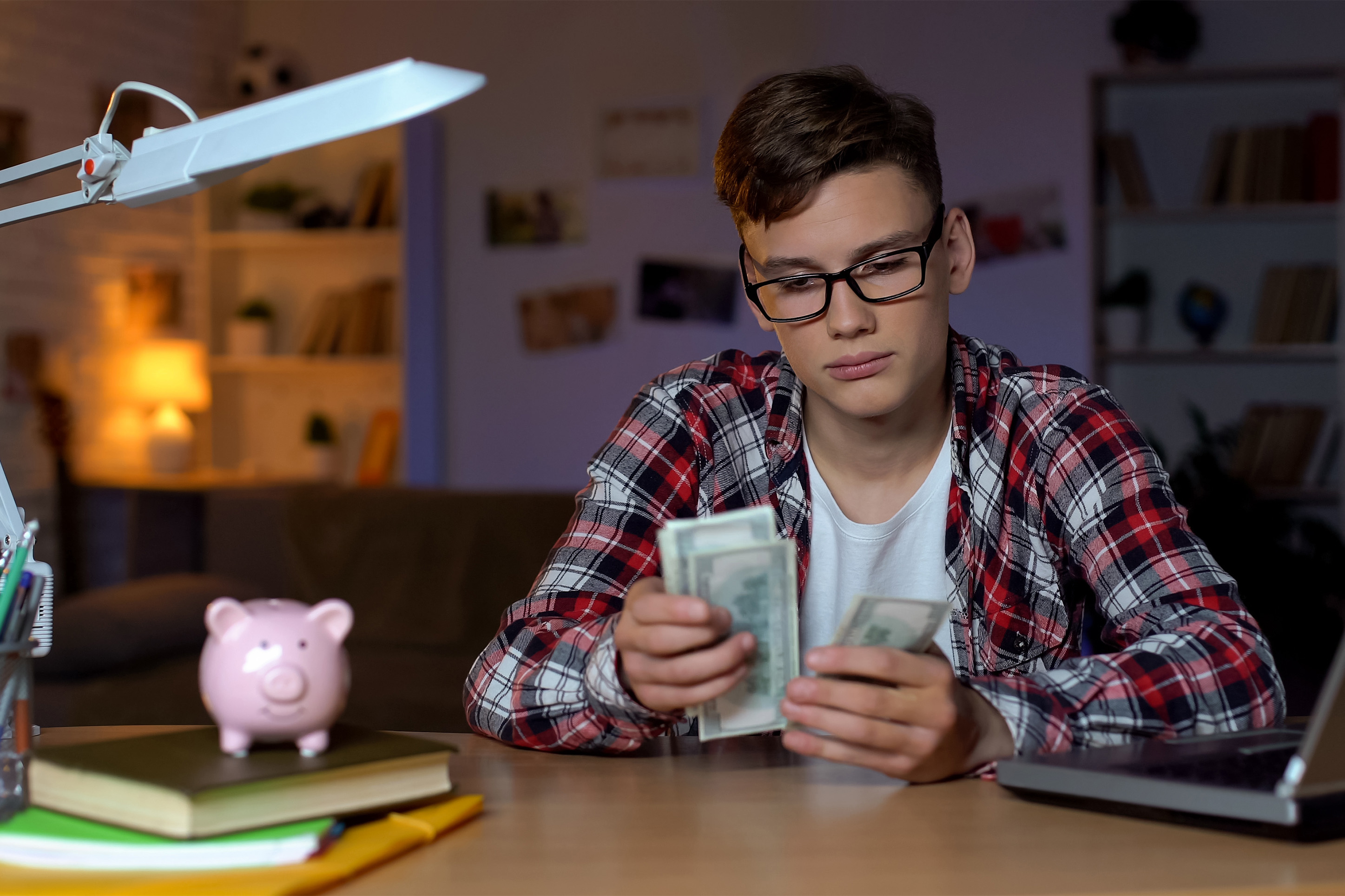 A young kid budgeting cash. 