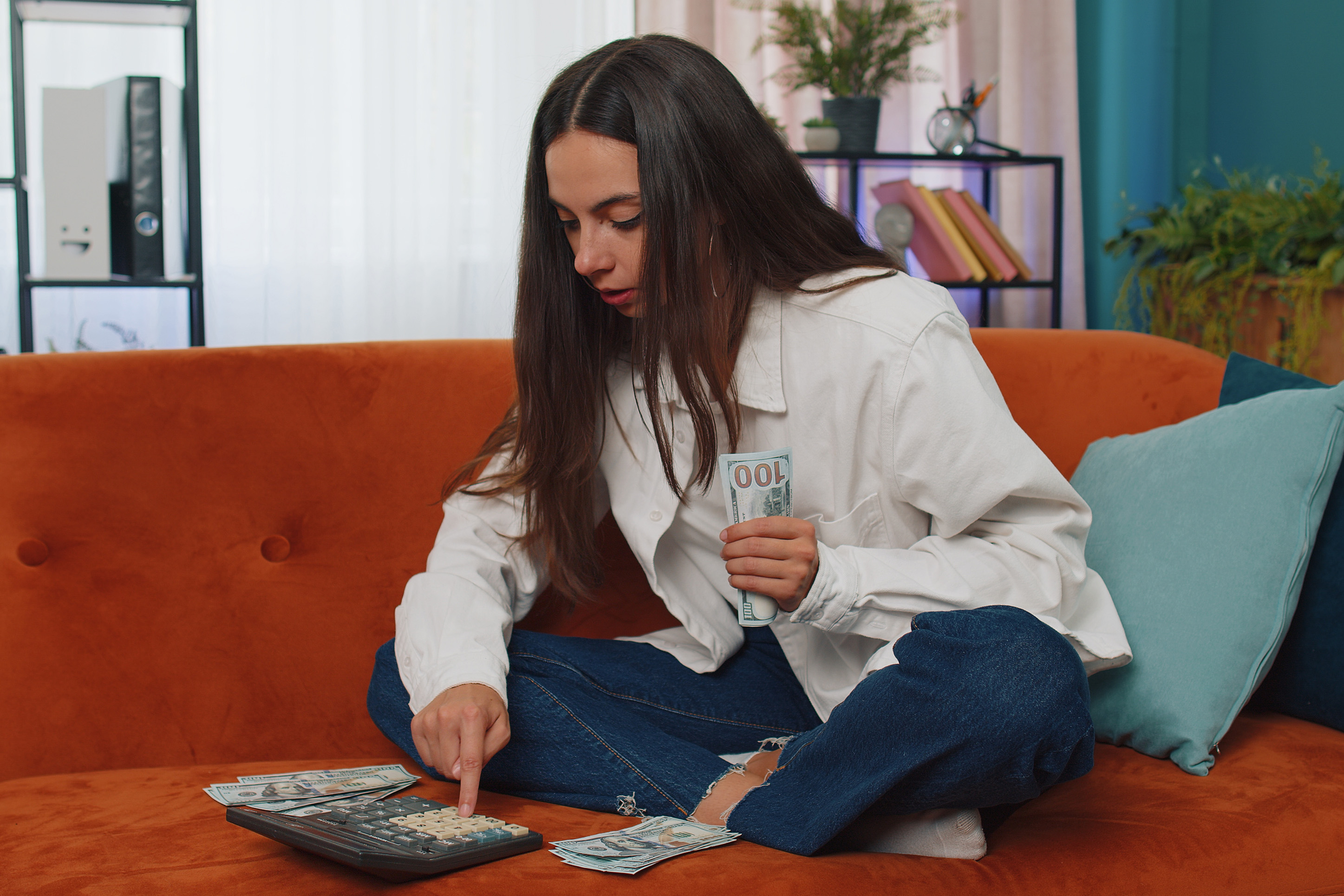 Young girl working on her finances. 