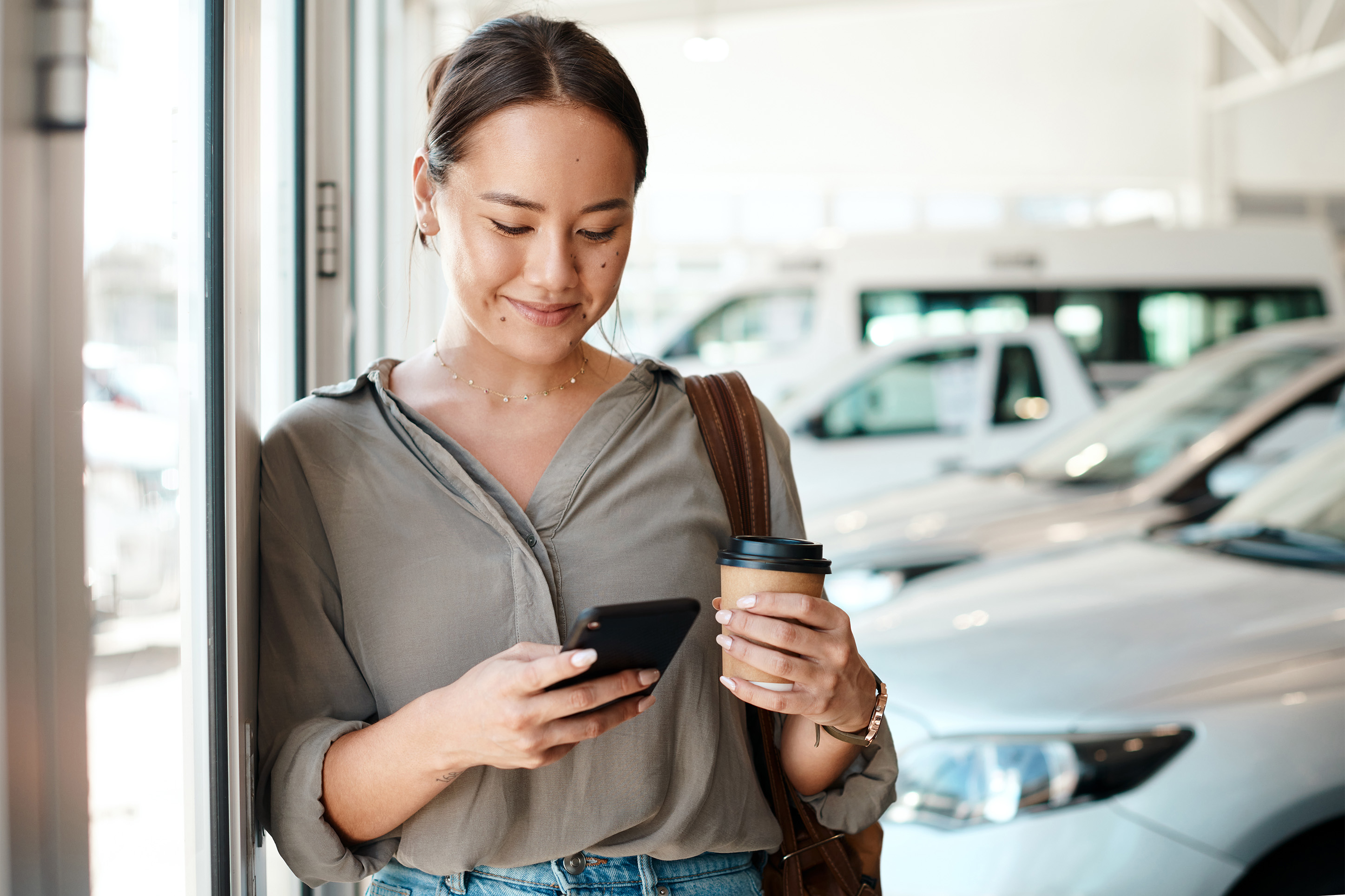 Woman at a car dealership