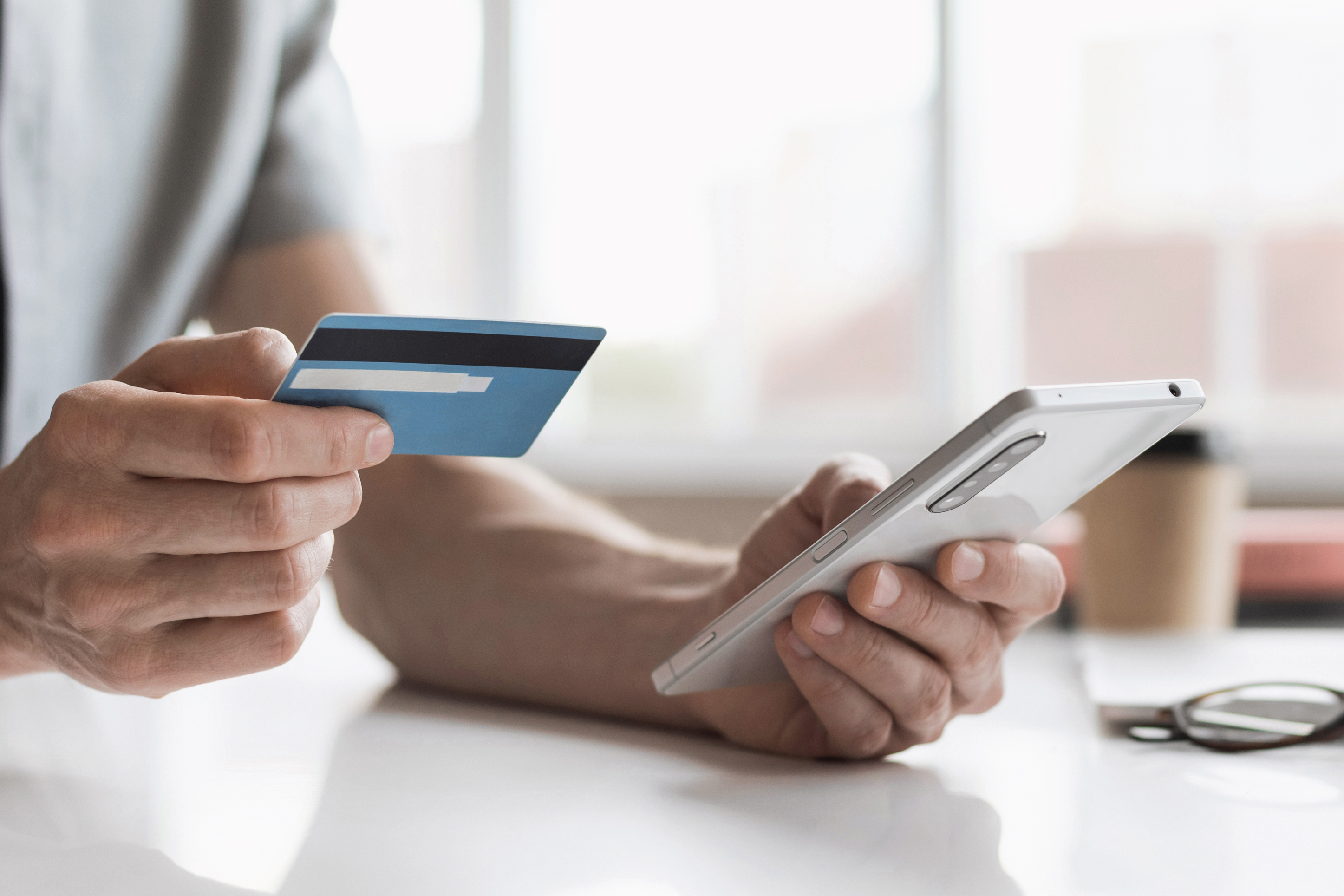 someone paying with their credit card on their phone