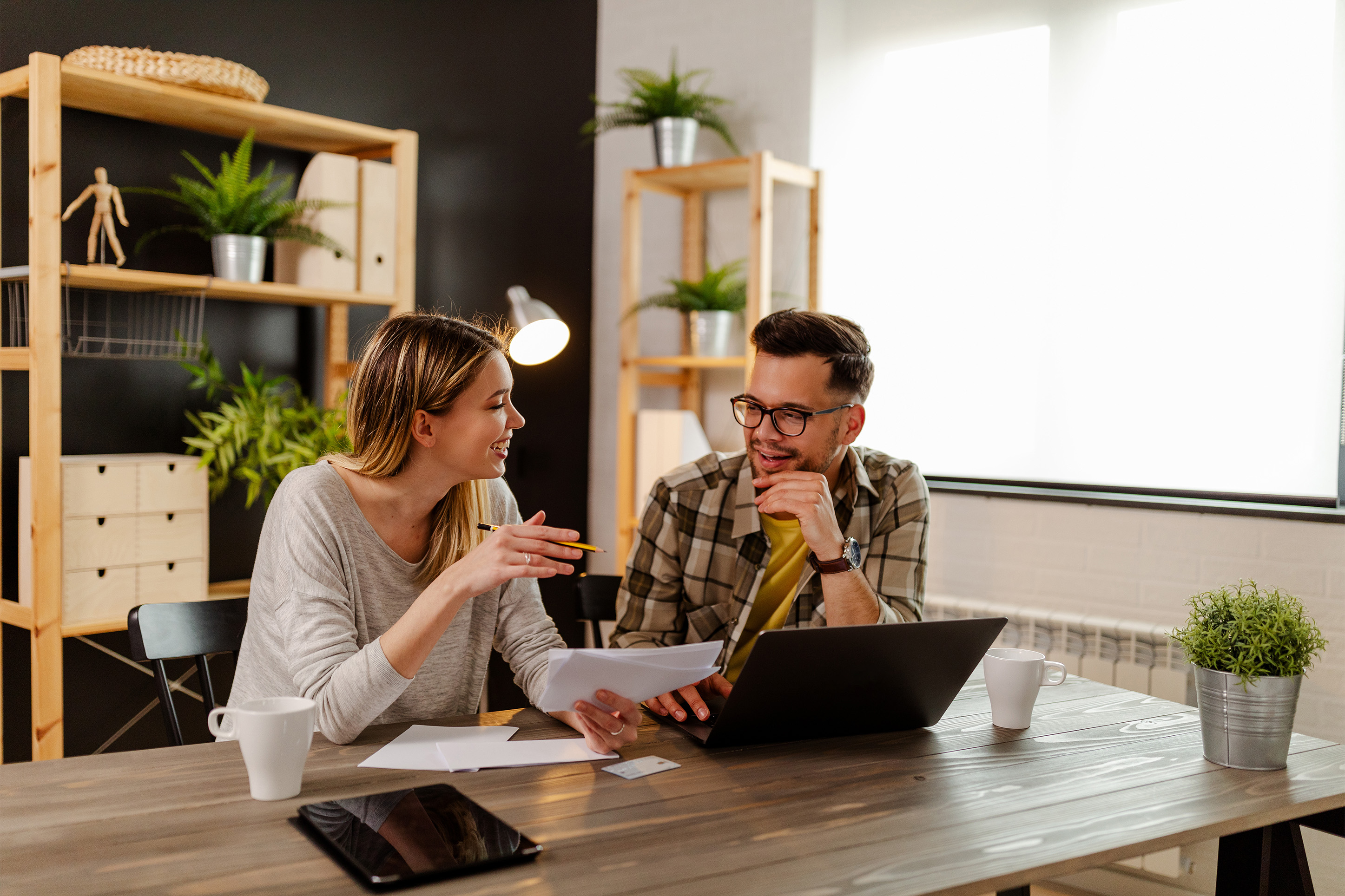 Man and woman discussing finances. 