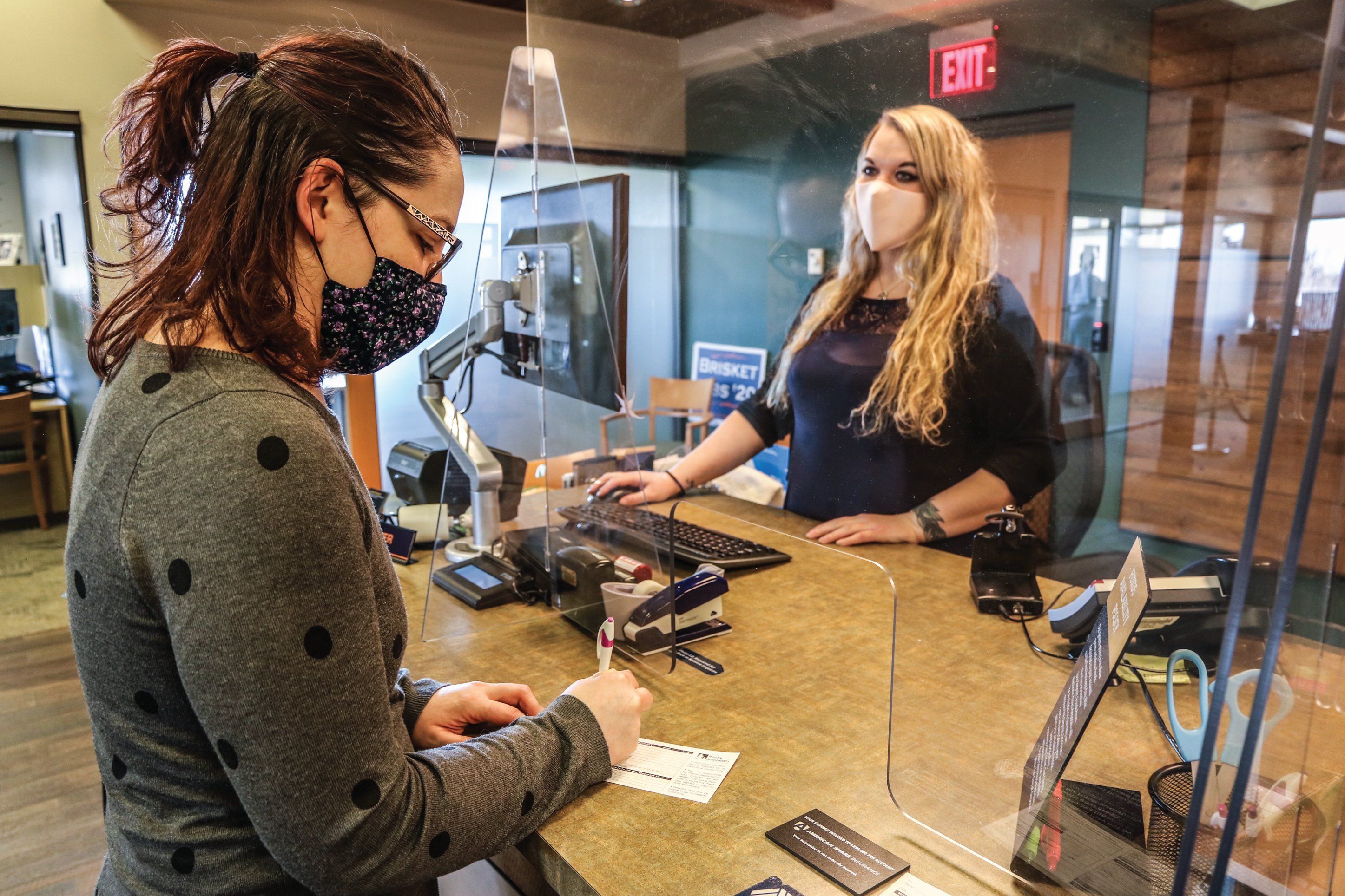 woman helping a member at a credit union