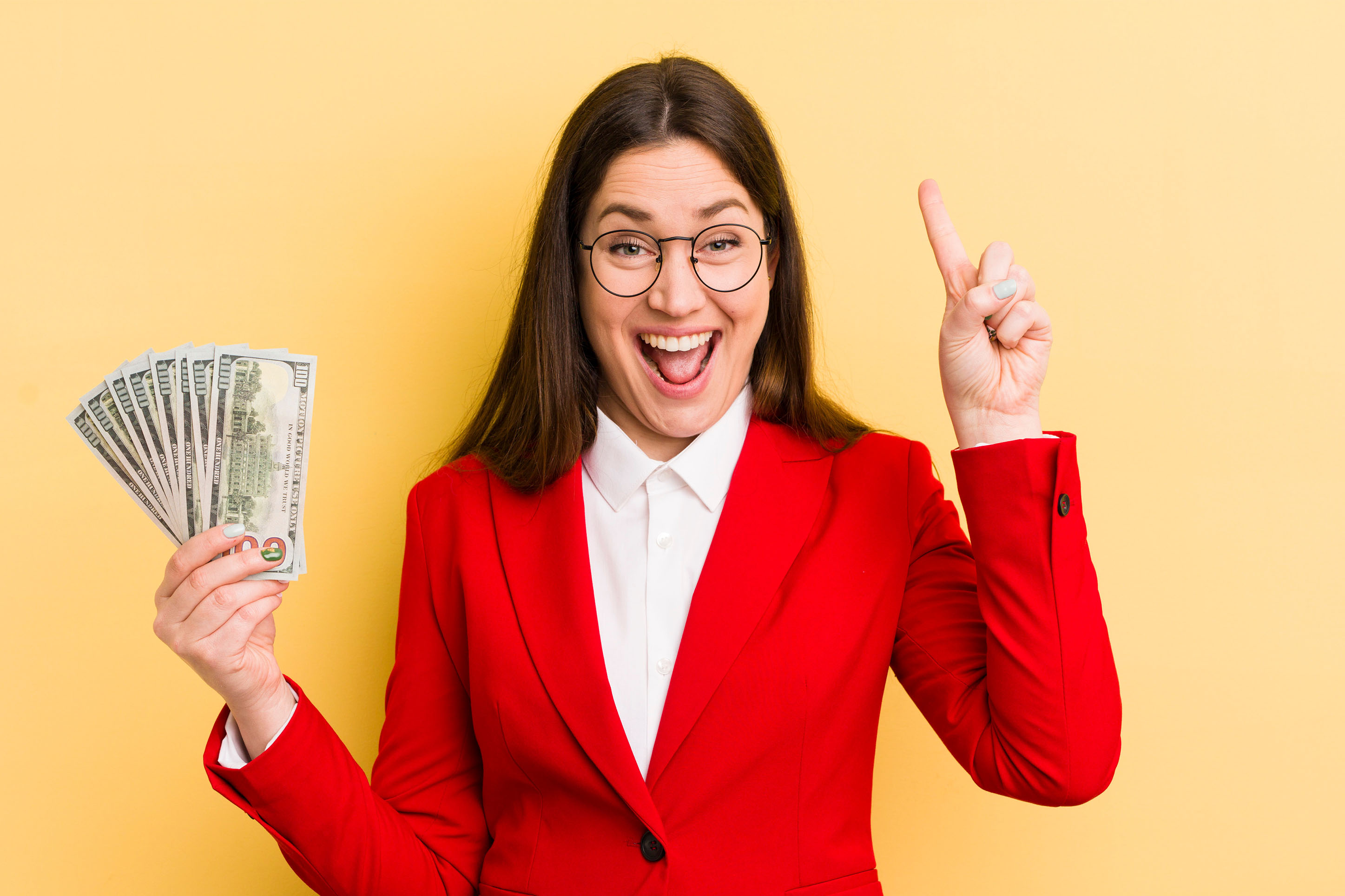 Photo of a woman holding a lot of cash. 
