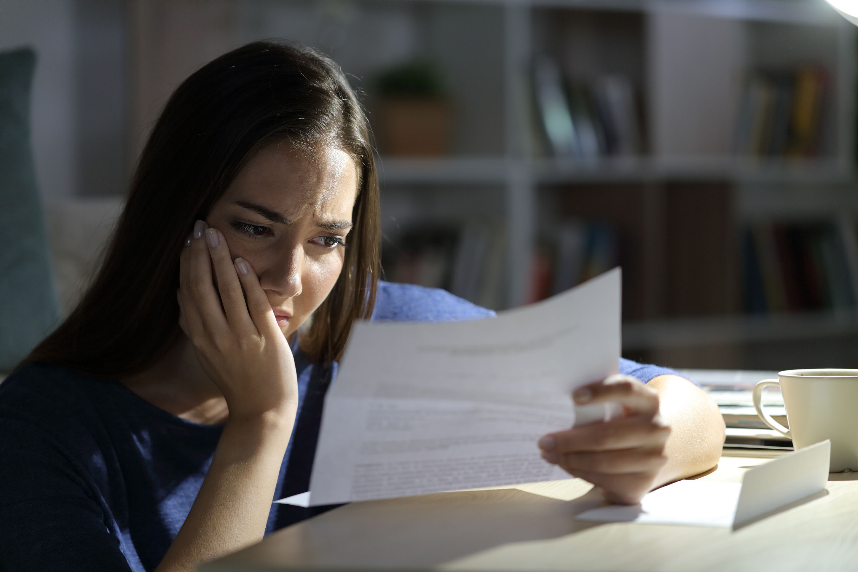 Woman worrying about finances. 